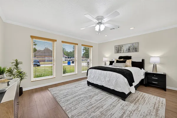 a spacious bedroom with a large bed and a large window