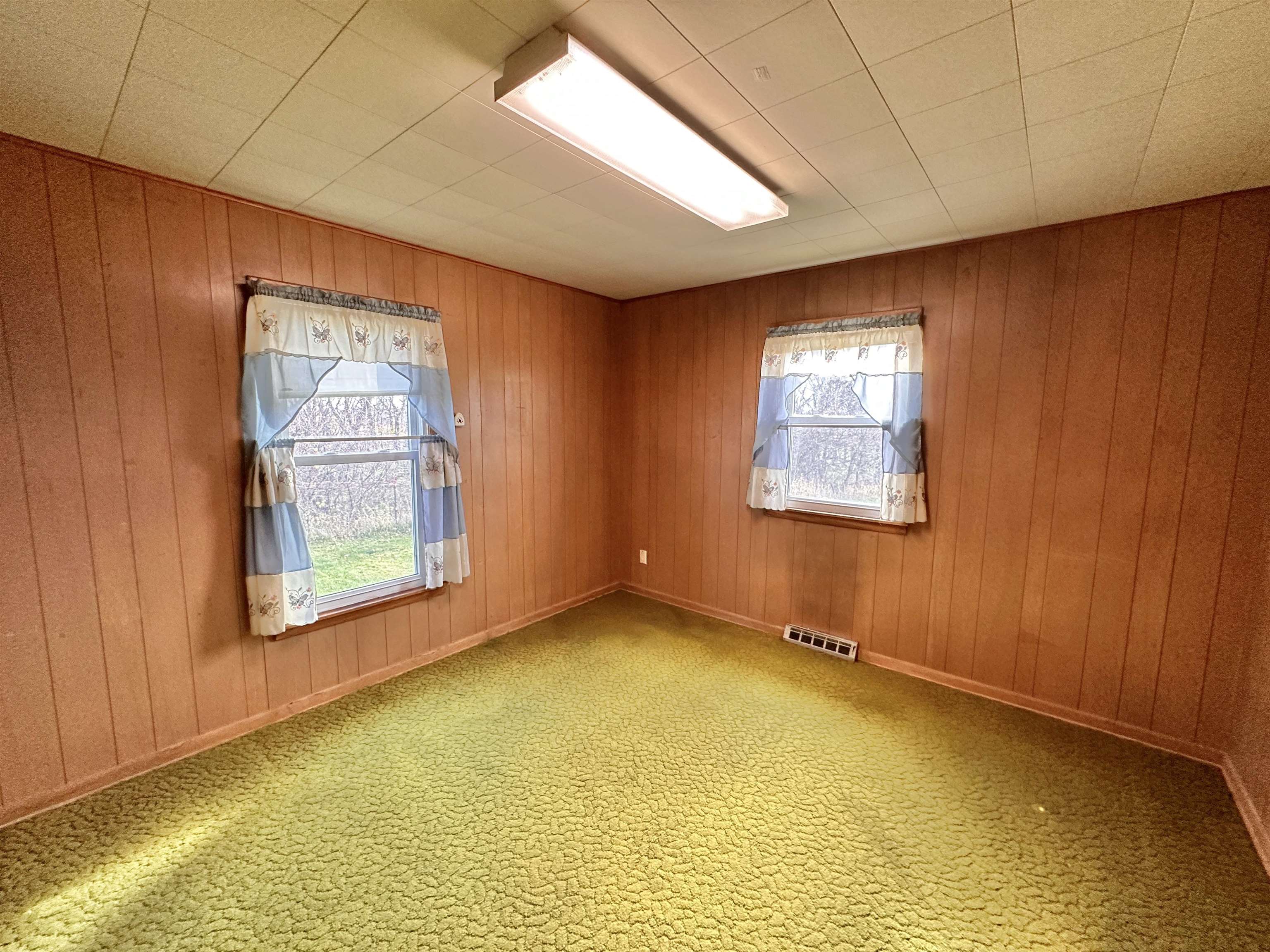 733 North Rock City Road Ridott, IL 61067 - Photo 19 of 35 a view of an empty room with a window