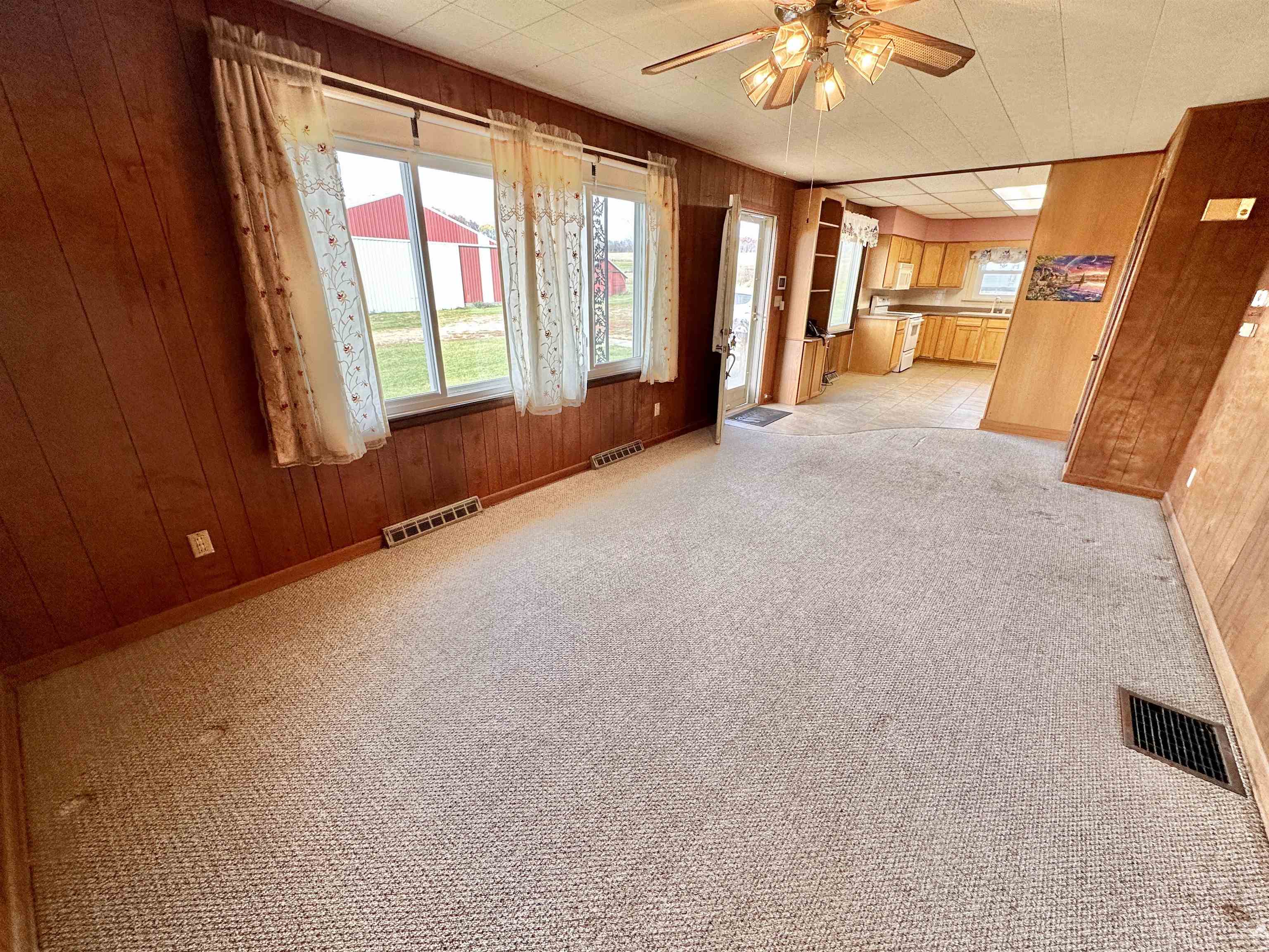 733 North Rock City Road Ridott, IL 61067 - Photo 6 of 35 a view of an empty room with a window