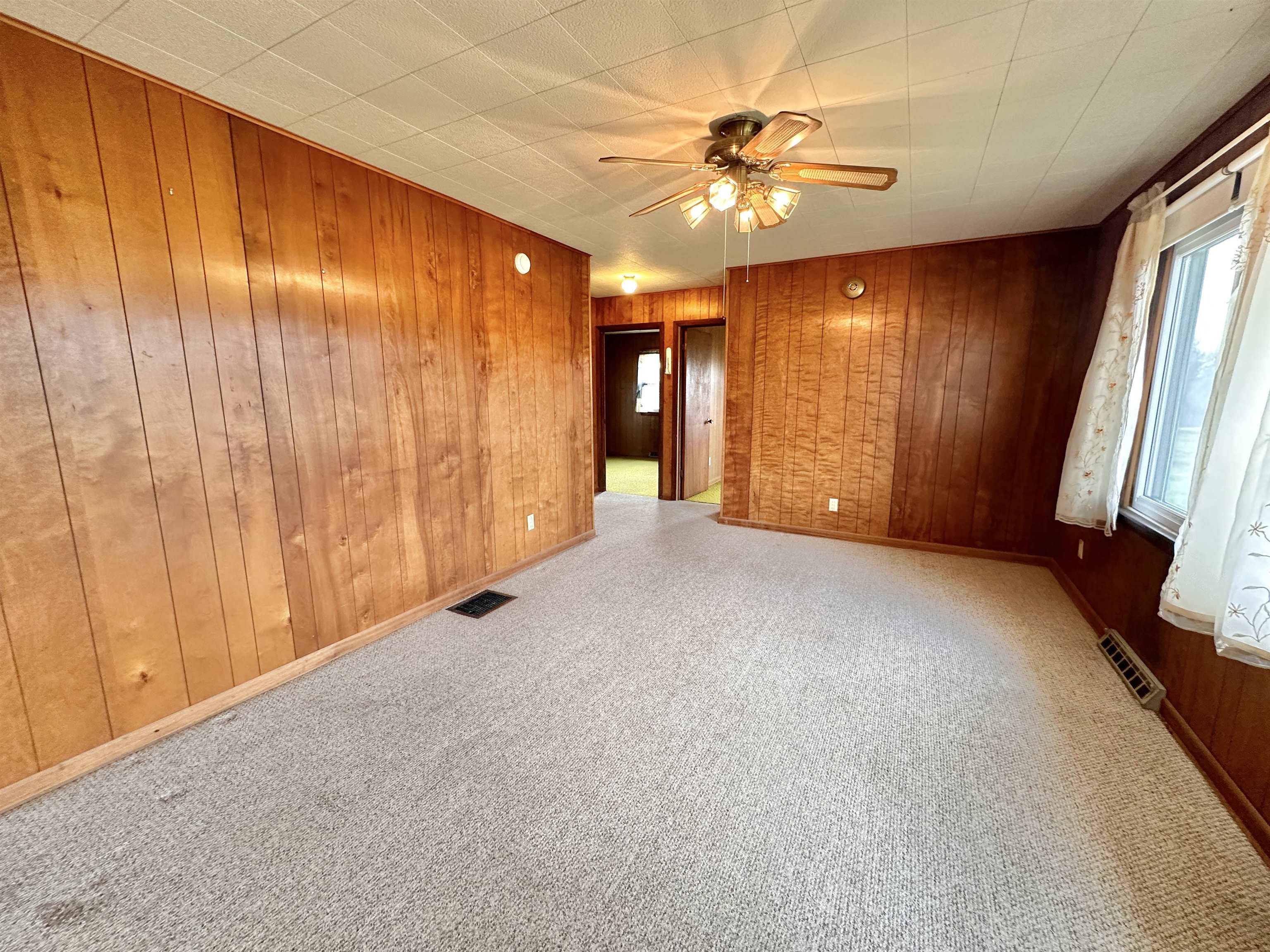 733 North Rock City Road Ridott, IL 61067 - Photo 8 of 35 a view of an empty room with a window