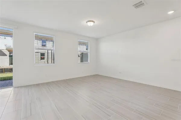 a large kitchen with stainless steel appliances granite countertop a sink a refrigerator and a granite counter tops