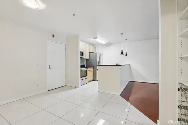 a view of kitchen with white cabinets