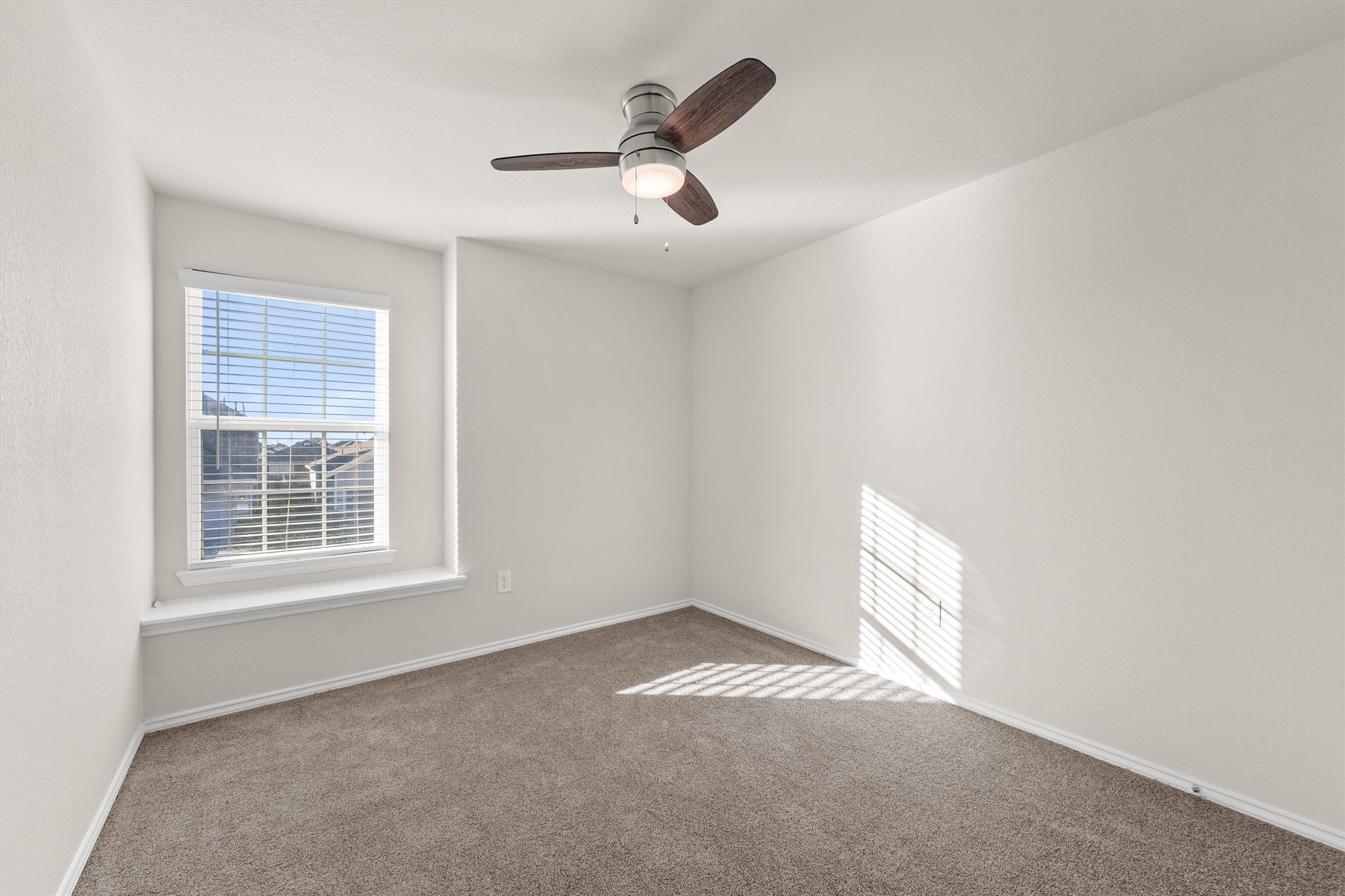 5710 Pampus Prairie Road Katy, TX 77493 - Photo 12 of 27 an empty room with a window