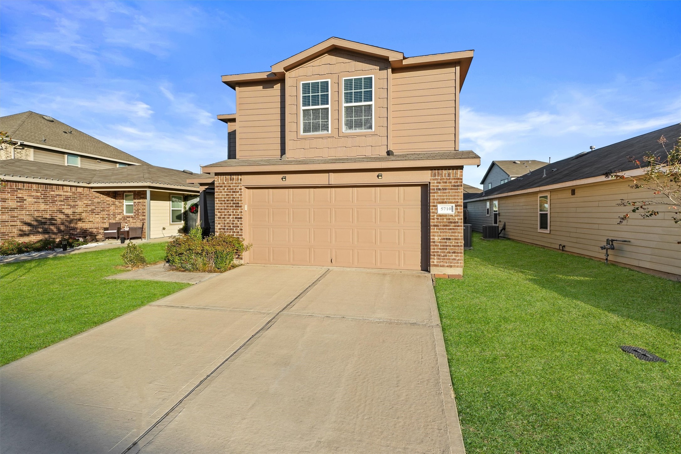 5710 Pampus Prairie Road Katy, TX 77493 - Photo 2 of 27 a front view of a house with a yard and garage
