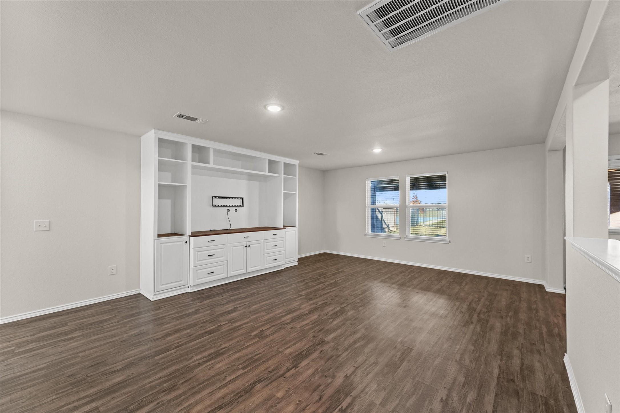 5710 Pampus Prairie Road Katy, TX 77493 - Photo 6 of 27 wooden floor in an empty room with a window
