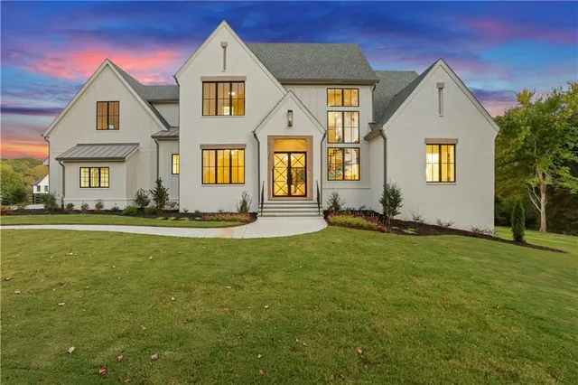 a front view of a house with a yard