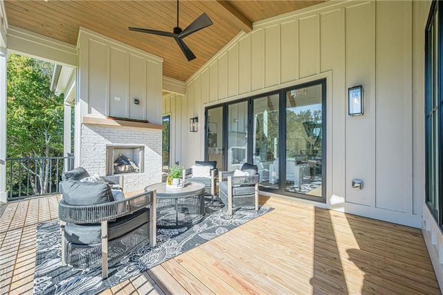 a spacious bathroom with a double vanity sink a mirror and a bathtub