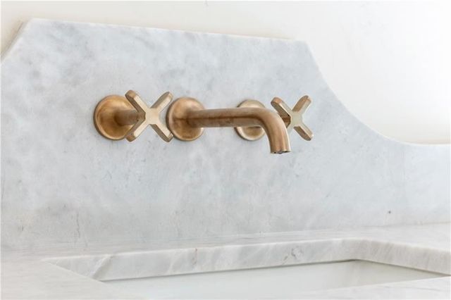 a view of a patio with a table and chairs and potted plants