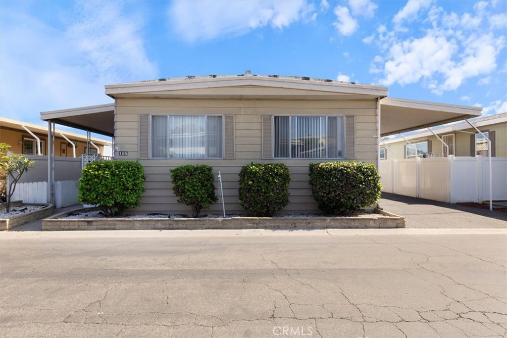 300 North Rampart Street, Unit 195 Orange, CA 92868 - Photo 2 of 25 front view of a house with a small yard