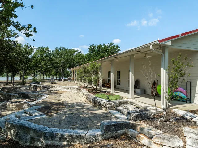 a view of a park with large trees