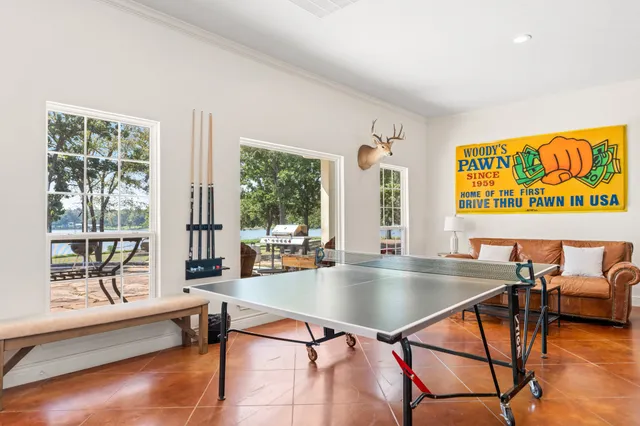 a bed room with a bed and a chandelier