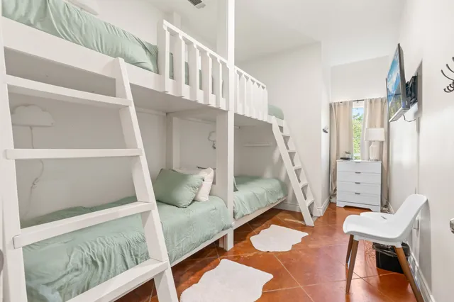 a balcony with table and chairs