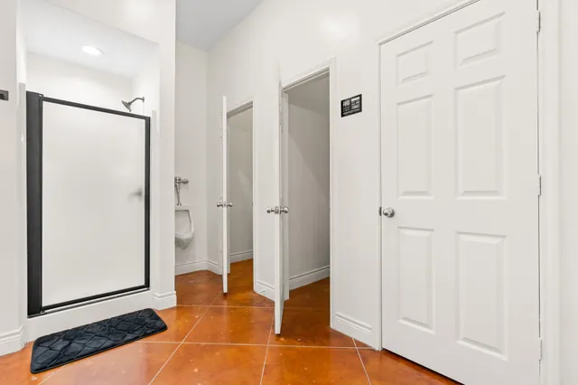 a view of a hallway with a white walls