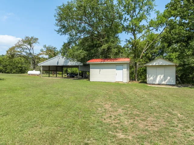 an outdoor space with furniture and garden