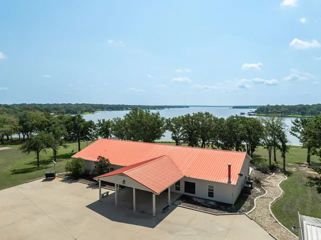 a front view of a house with lake view