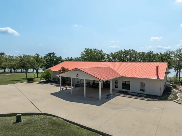 an outdoor space with pool and furniture