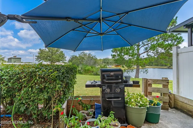 a view of a yard with a house in the background