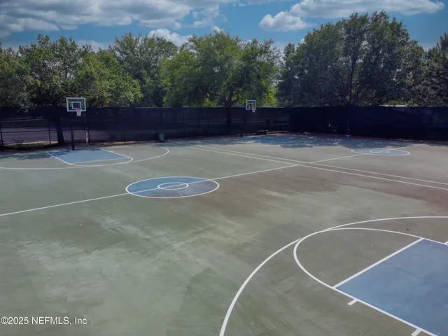 a view of a lake with houses in the back