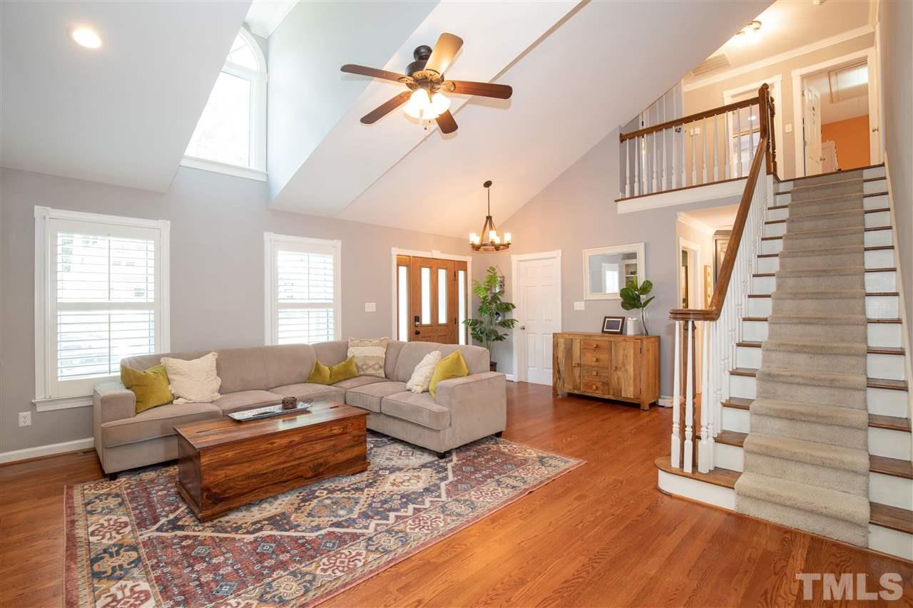 715 Rosemont Avenue Raleigh, NC 27607 - Photo 3 of 26 a living room with furniture and wooden floor