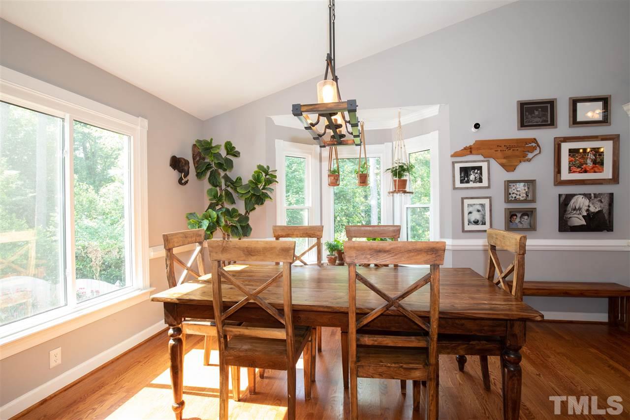 715 Rosemont Avenue Raleigh, NC 27607 - Photo 4 of 26 a view of a dining room with furniture window and outside view
