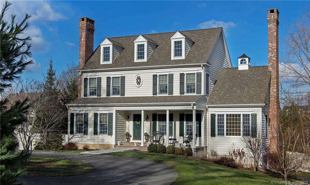 77 Prospect Street Ridgefield, CT 06877 - Photo 1 of 1 a front view of a house with a yard
