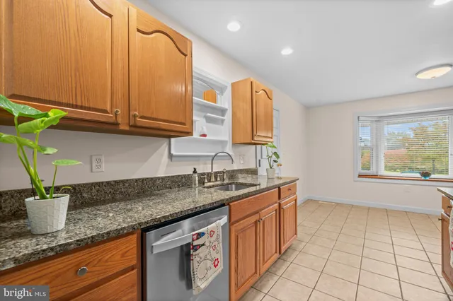 a view of a livingroom with furniture and a window