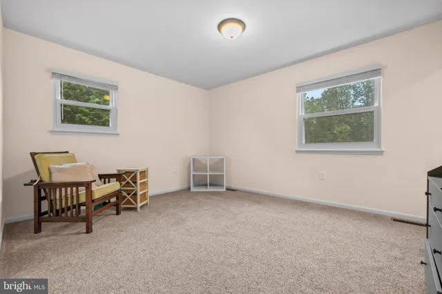 a bedroom with a bed and a mirror