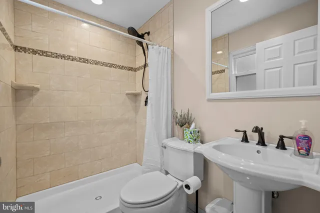 a bedroom with a bunk bed window and a dresser