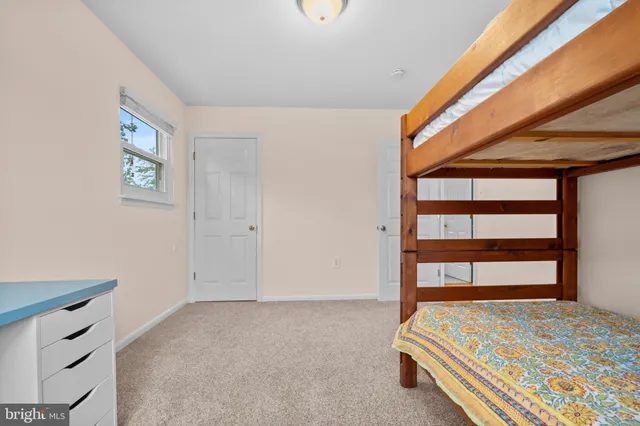 a view of a livingroom with furniture and a flat screen tv