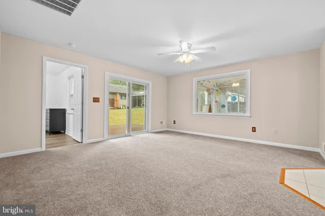 a kitchen with stainless steel appliances granite countertop a sink a stove and a wooden cabinets