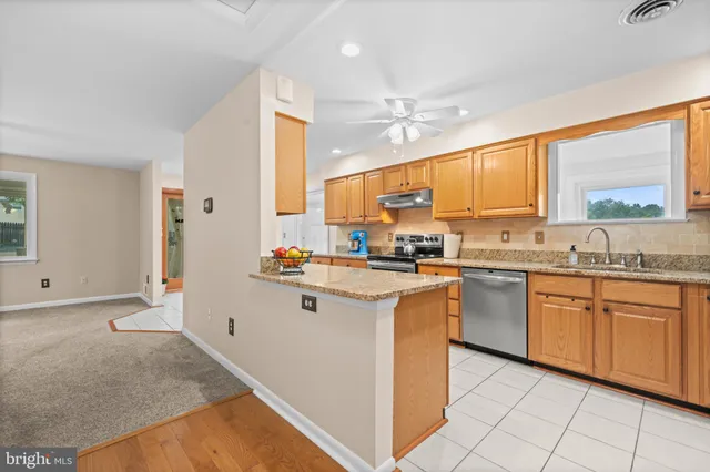 a view of a house with backyard and porch