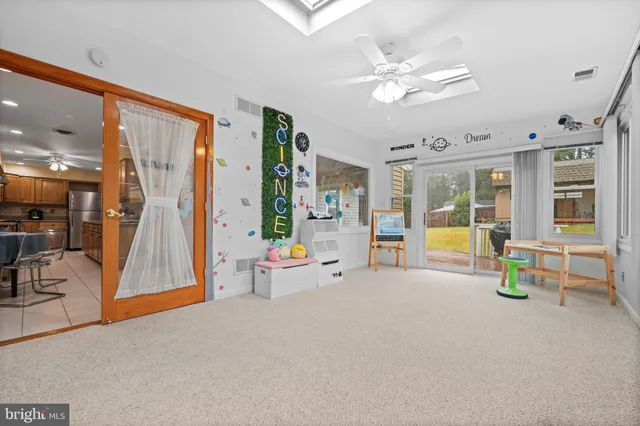 a backyard of a house with yard and outdoor seating