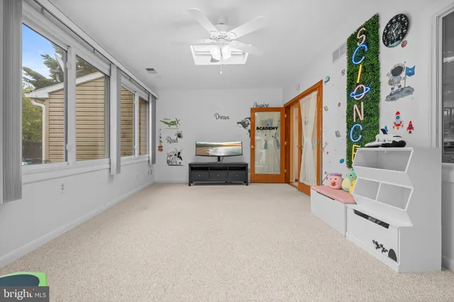 a view of a backyard with wooden fence