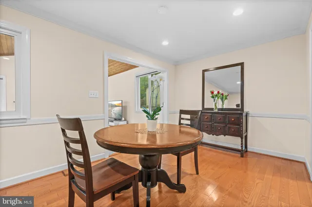 a living room with furniture a table and a fireplace