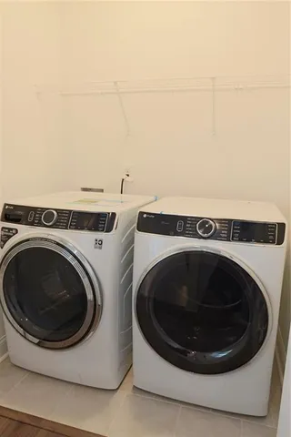 a view of swimming pool outdoor seating and city view