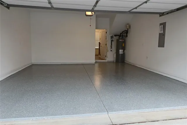 a living room with patio furniture and a fireplace with wooden floor