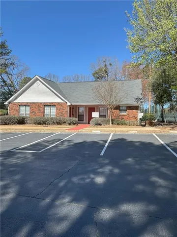 a house with trees in front of it