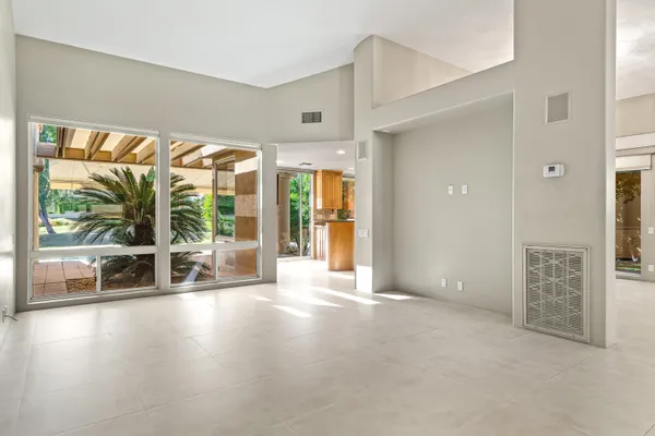 a kitchen with stainless steel appliances wooden cabinets and a stove top oven