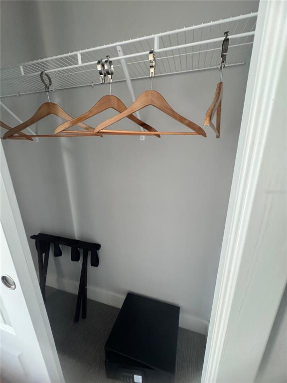 7770 Sandy Ridge Drive, Unit 210 Reunion, FL 34747 - Photo 11 of 42 a view of walk in closet with clothes and shoes