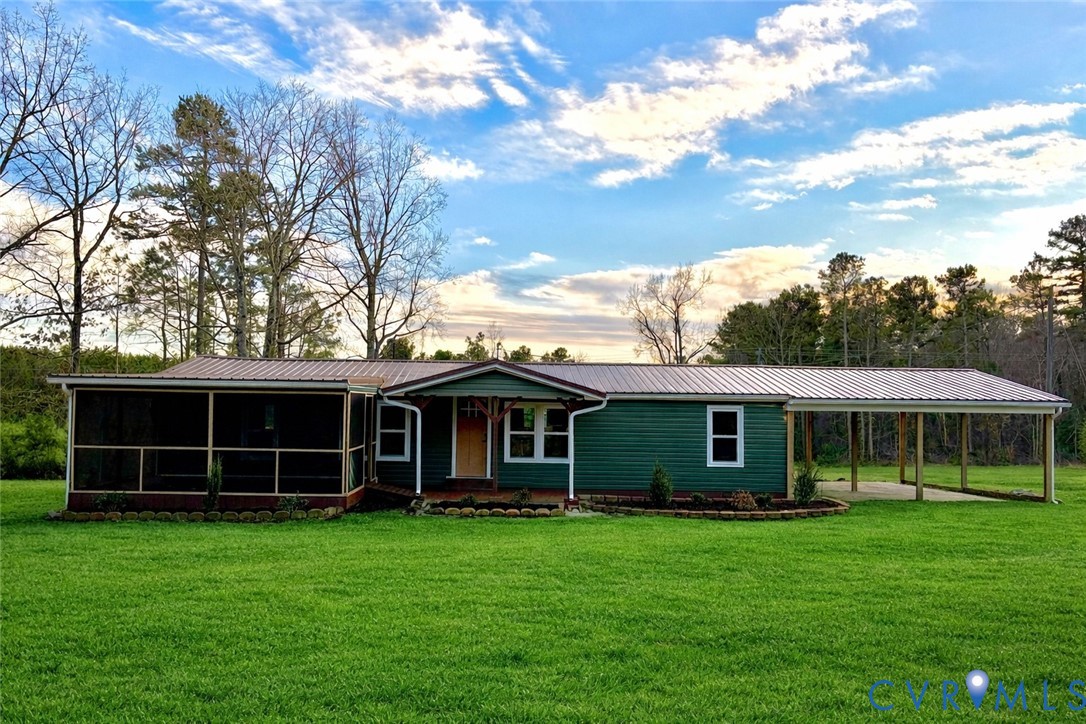 2207 Brodnax Road Brodnax, VA 23920 - Photo 1 of 1 a view of an house with backyard space and balcony