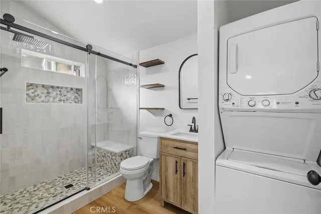 a bathroom with a toilet sink and shower