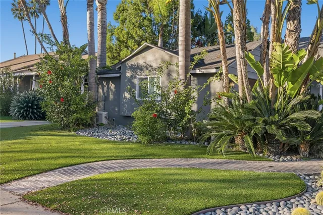 a view of a park with a palm trees