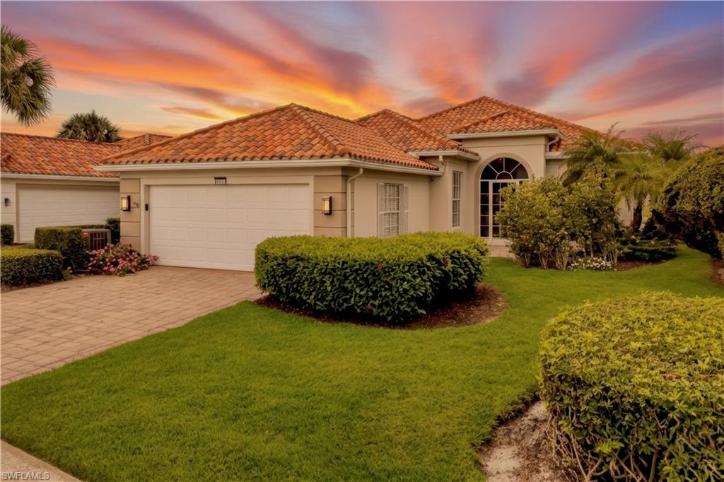 4453 Novato Court Naples, FL 34109 - Photo 1 of 7 a view of a front of a house with a yard