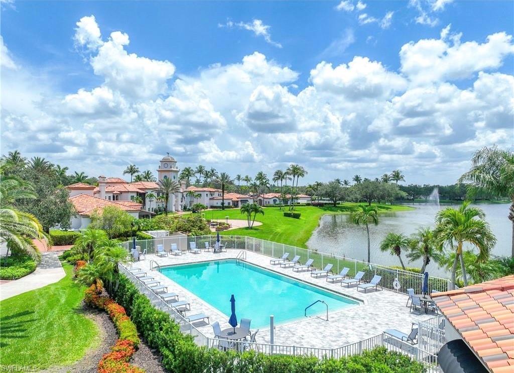 4453 Novato Court Naples, FL 34109 - Photo 4 of 7 a view of a lake with a house