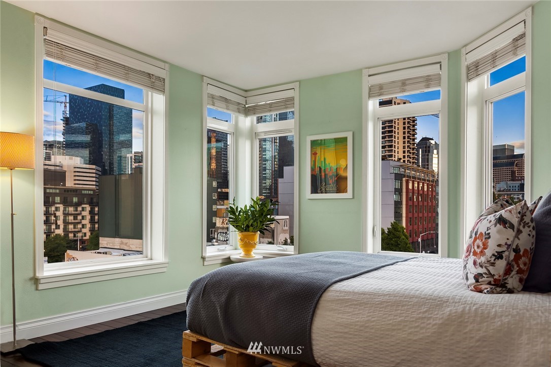 2415 2nd Avenue, Unit 734 Seattle, WA 98121 - Photo 13 of 23 a bedroom with a bed and a window