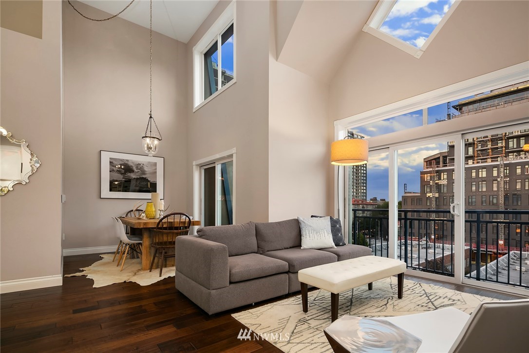2415 2nd Avenue, Unit 734 Seattle, WA 98121 - Photo 4 of 23 a living room with furniture and a window
