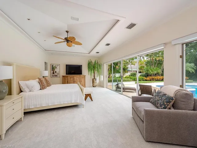 a spacious bathroom with a large tub sink and mirror