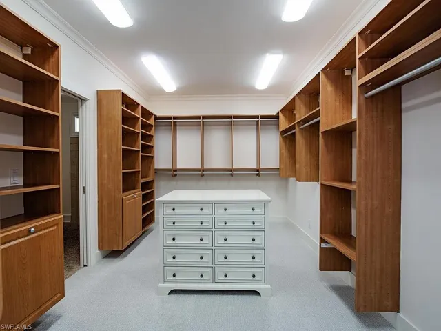a living room with furniture a rug and a large window