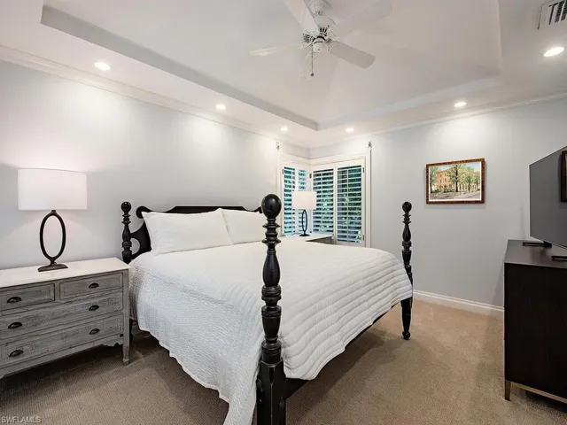 a bathroom with a granite countertop sink a mirror and a shower
