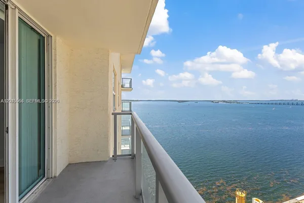a view of a balcony with an ocean